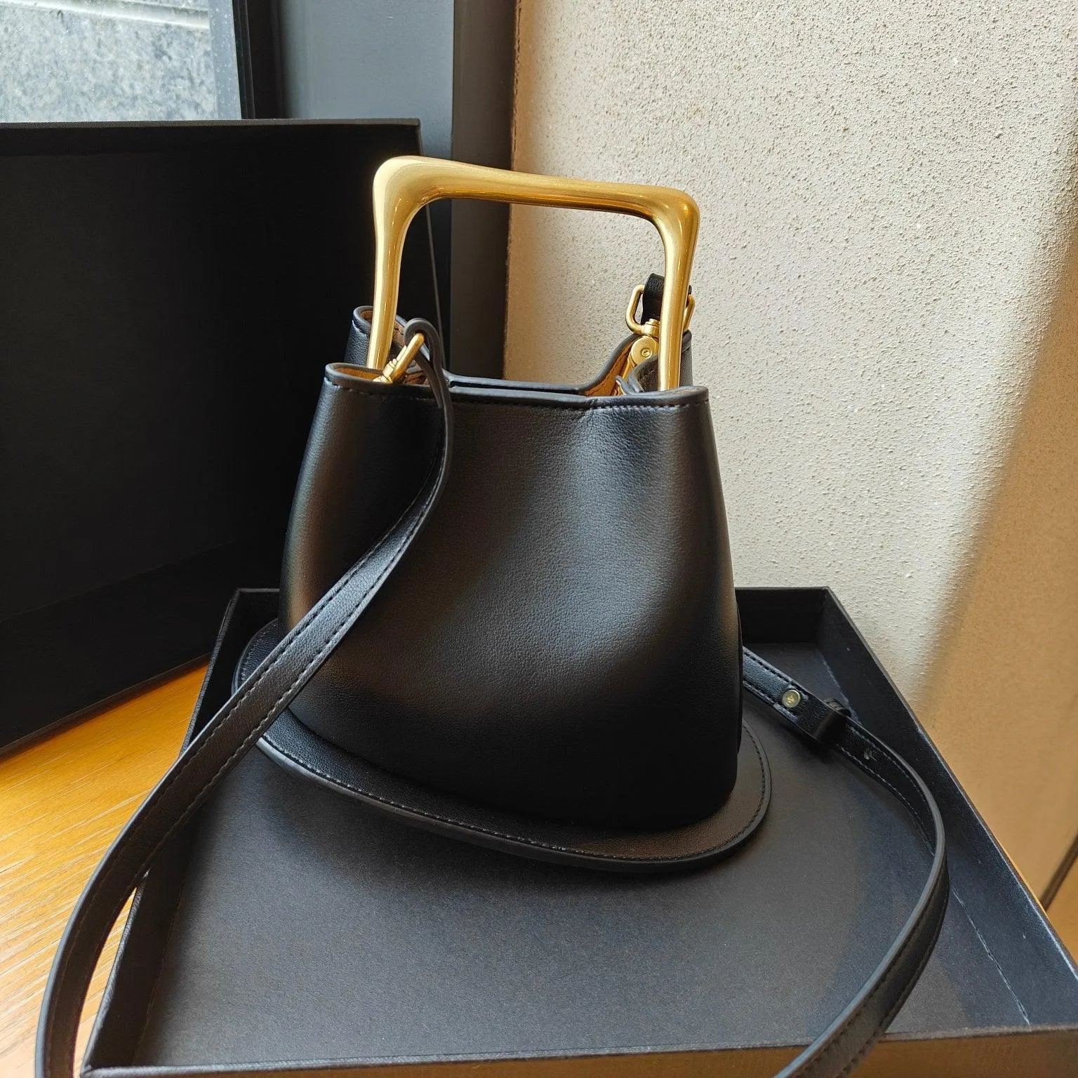 IT Ozzy Bag | Modern Chic Leather Shoulder Bucket Bag with Amber Acrylic Handles