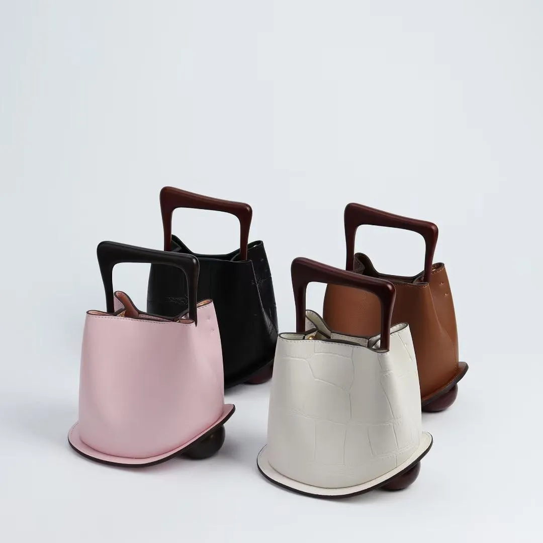 IT Ozzy Bag | Modern Chic Leather Shoulder Bucket Bag with Amber Acrylic Handles