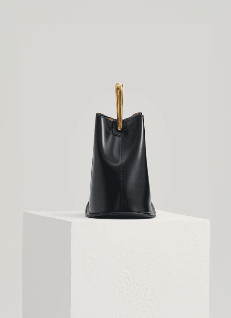 IT Ozzy Bag | Modern Chic Leather Shoulder Bucket Bag with Amber Acrylic Handles