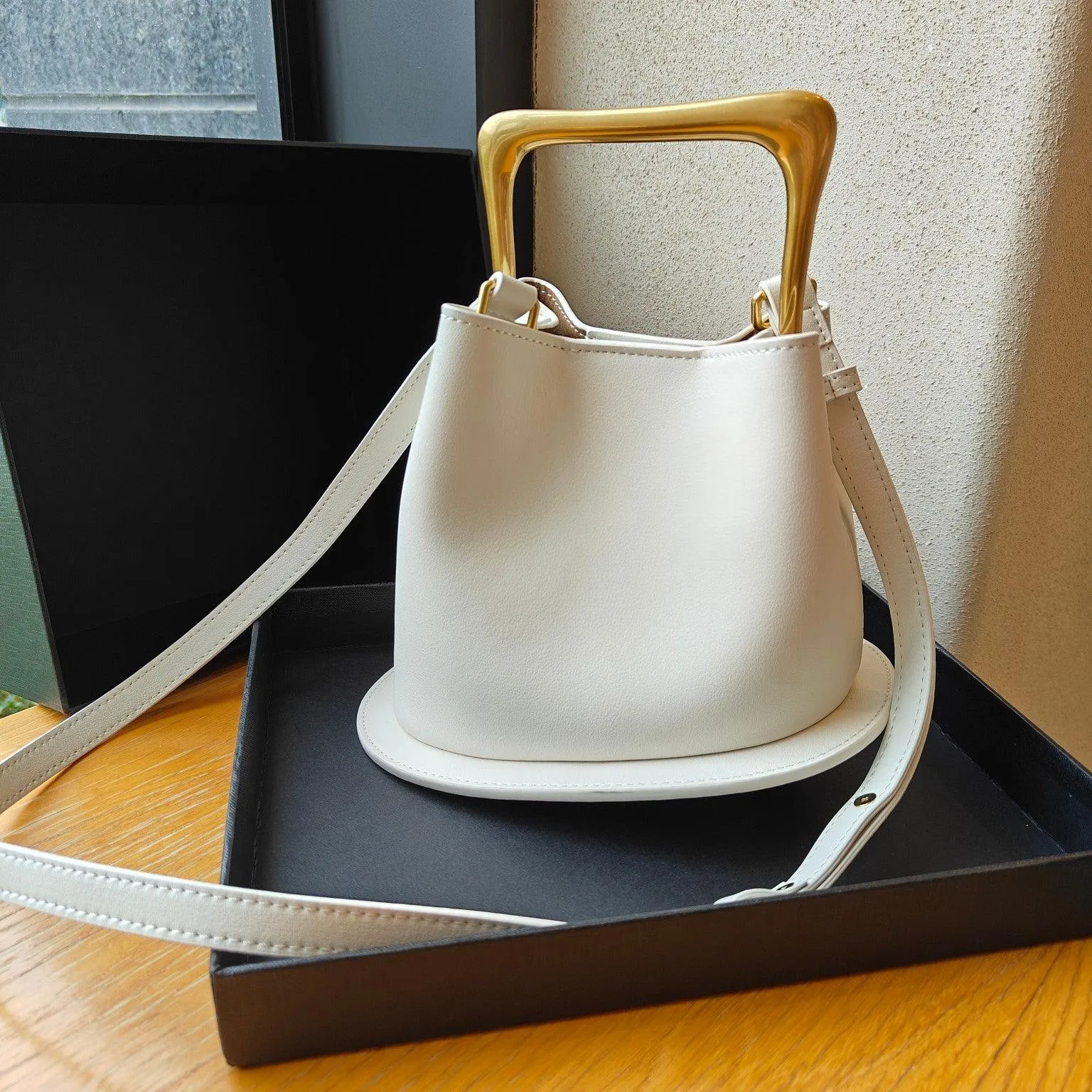 IT Ozzy Bag | Modern Chic Leather Shoulder Bucket Bag with Amber Acrylic Handles