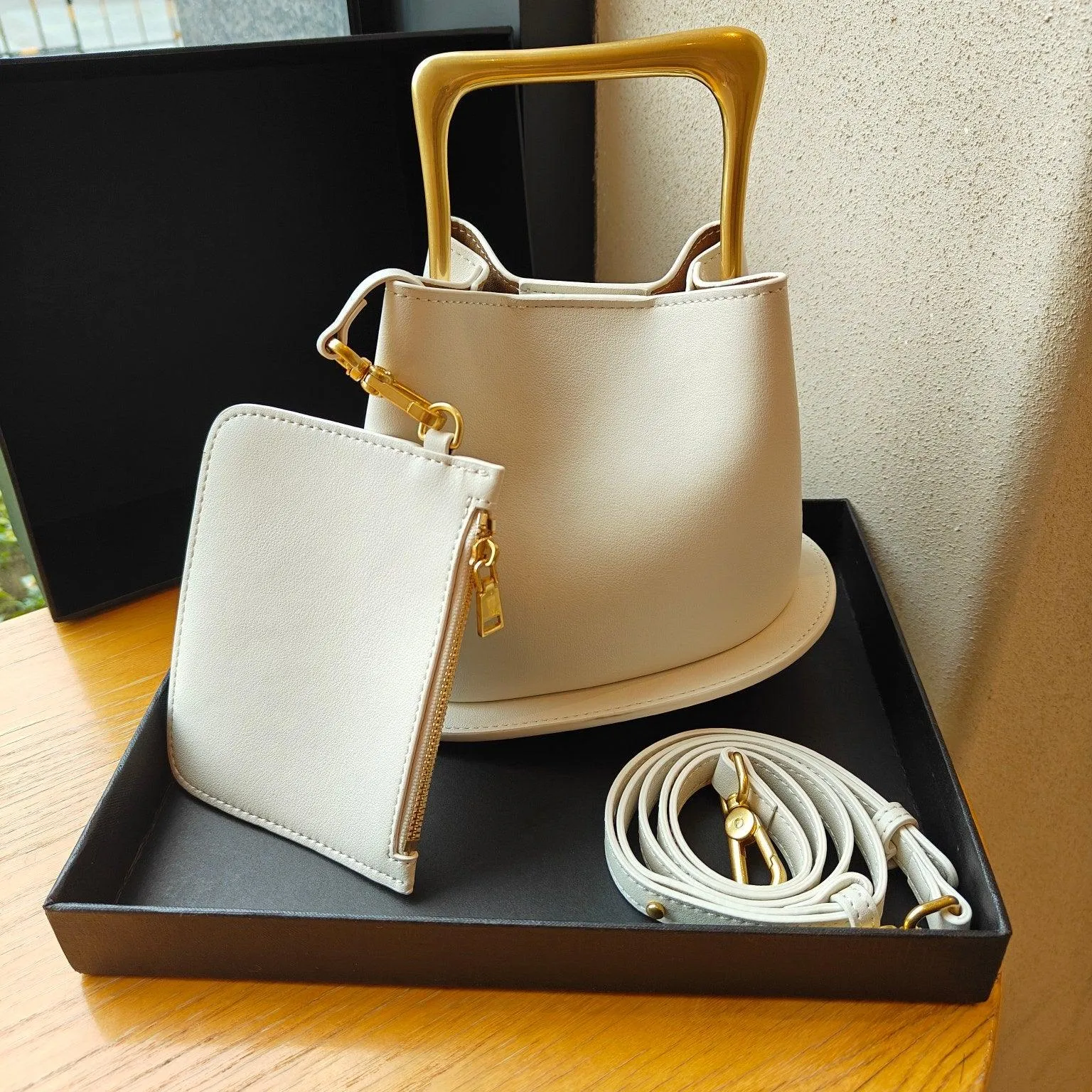 IT Ozzy Bag | Modern Chic Leather Shoulder Bucket Bag with Amber Acrylic Handles