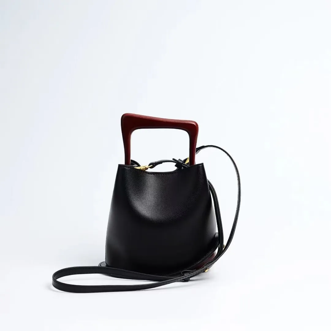 IT Ozzy Bag | Modern Chic Leather Shoulder Bucket Bag with Amber Acrylic Handles