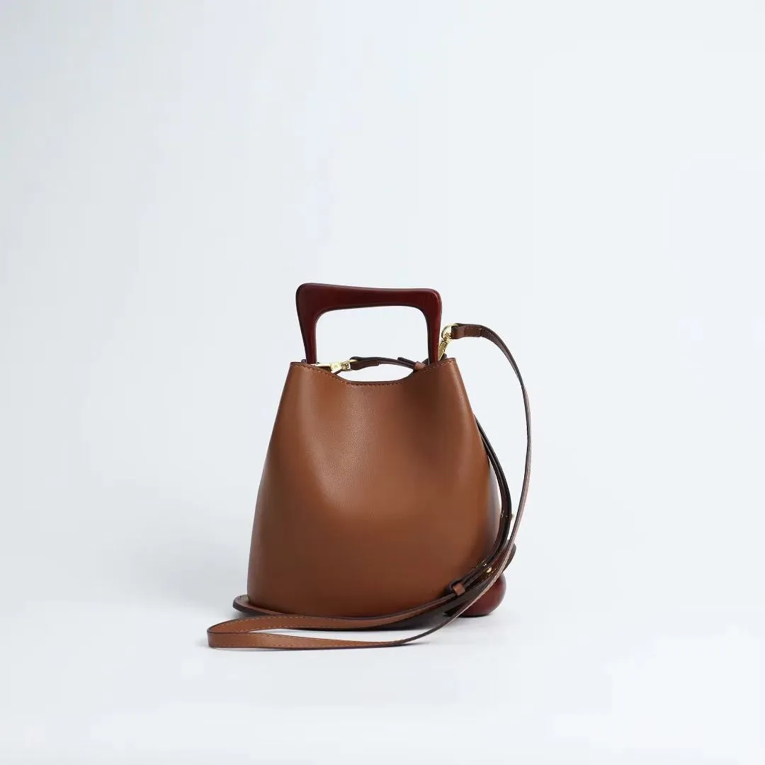 IT Ozzy Bag | Modern Chic Leather Shoulder Bucket Bag with Amber Acrylic Handles