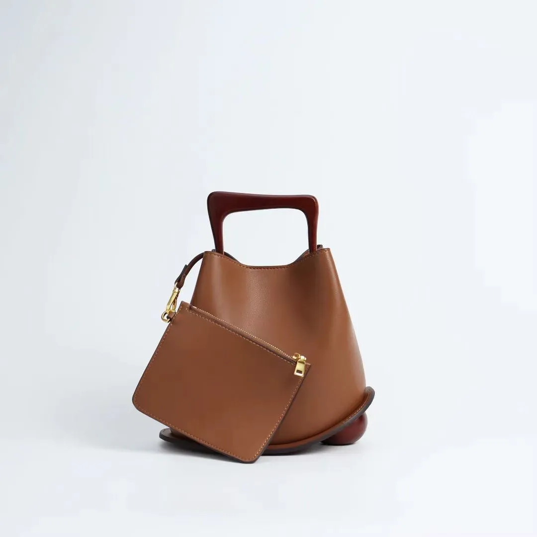 IT Ozzy Bag | Modern Chic Leather Shoulder Bucket Bag with Amber Acrylic Handles